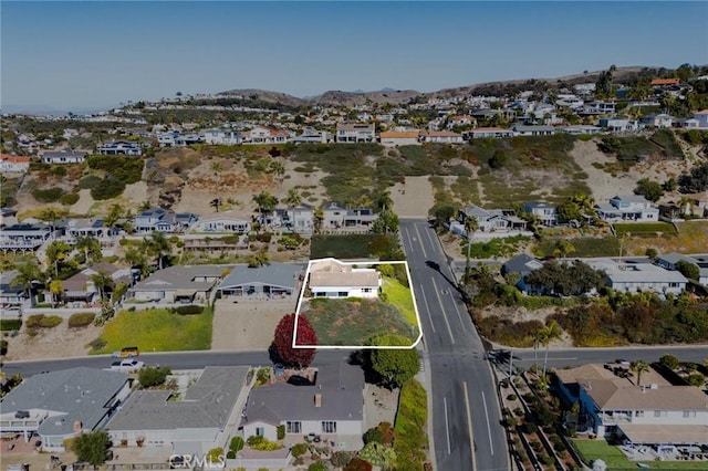 4101 Calle Mayo, San Clemente, CA 92673 - aerial overview of property's location featuring nearby suburban area, property parcel outlined, and a mountainous background
