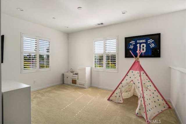 recreation room featuring carpet floors, baseboards, and recessed lighting
