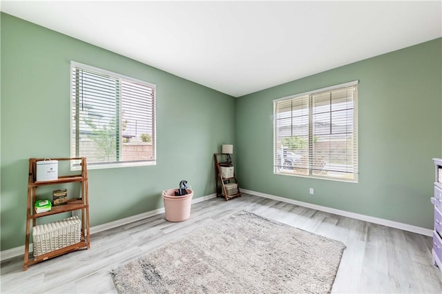 29652 Falcon Hill Dr, Menifee, CA 92584 - misc room featuring plenty of natural light, wood finished floors, and baseboards