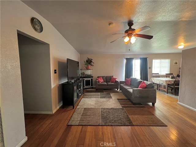 527 E King St, Rialto, CA 92376 - living area featuring ceiling fan, wood-type flooring, and baseboards