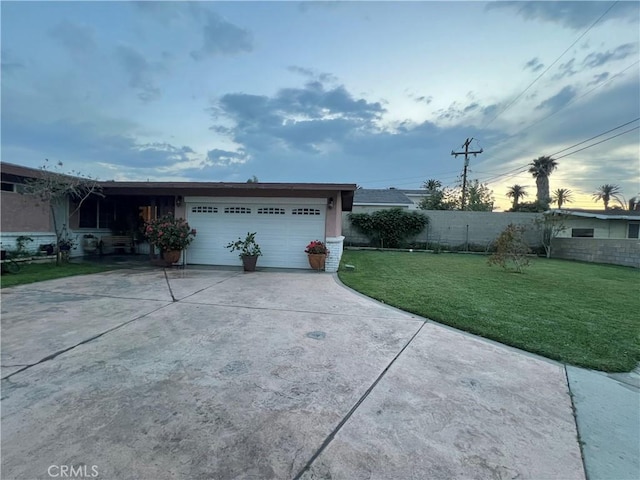 527 E King St, Rialto, CA 92376 - view of side of home with an attached garage, driveway, and stucco siding