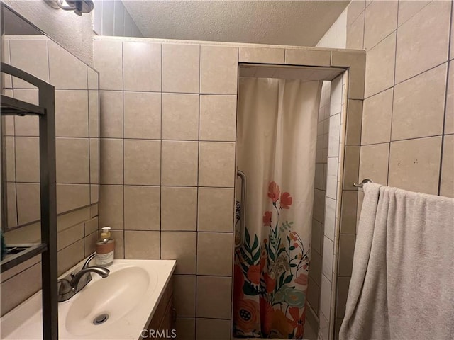 527 E King St, Rialto, CA 92376 - full bathroom featuring tile walls, a textured ceiling, vanity, and a shower with curtain