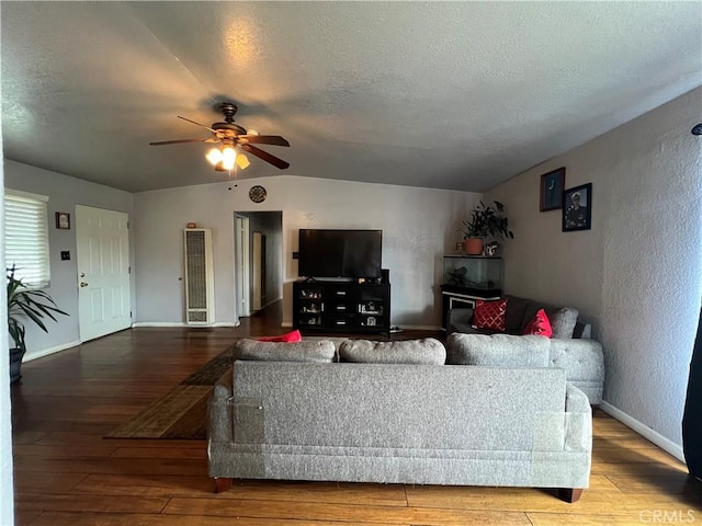 527 E King St, Rialto, CA 92376 - living room featuring wood finished floors, a ceiling fan, baseboards, a textured wall, and a textured ceiling