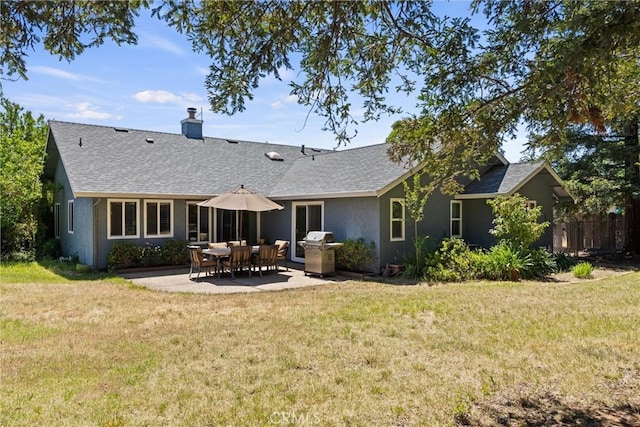 9 Benton Ave, Chico, CA 95973 - rear view of house featuring a patio, stucco siding, roof with shingles, and a chimney
