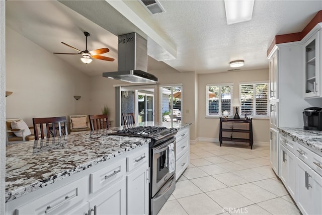 9 Benton Ave, Chico, CA 95973 - kitchen featuring gas range, ventilation hood, glass insert cabinets, ceiling fan, and light stone counters