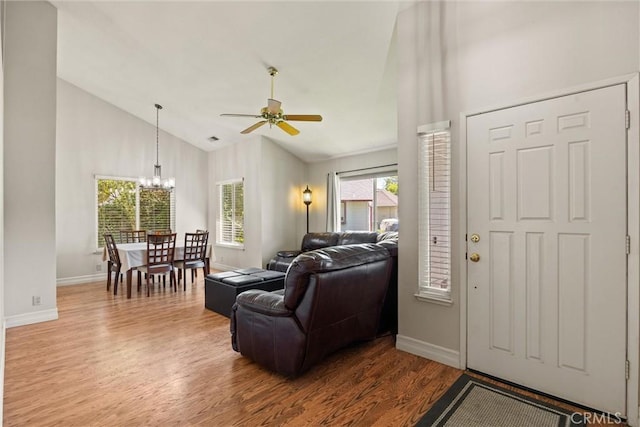 9 Benton Ave, Chico, CA 95973 - living room with a chandelier, wood finished floors, ceiling fan, baseboards, and high vaulted ceiling