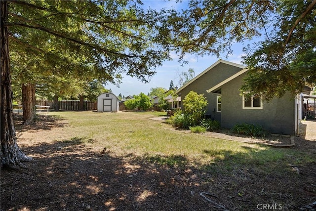 9 Benton Ave, Chico, CA 95973 - view of yard featuring a storage unit and an outdoor structure