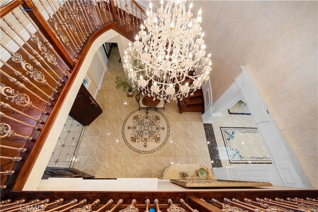 6829 Birmingham Dr, Chino, CA 91710 - entryway with a chandelier and arched walkways