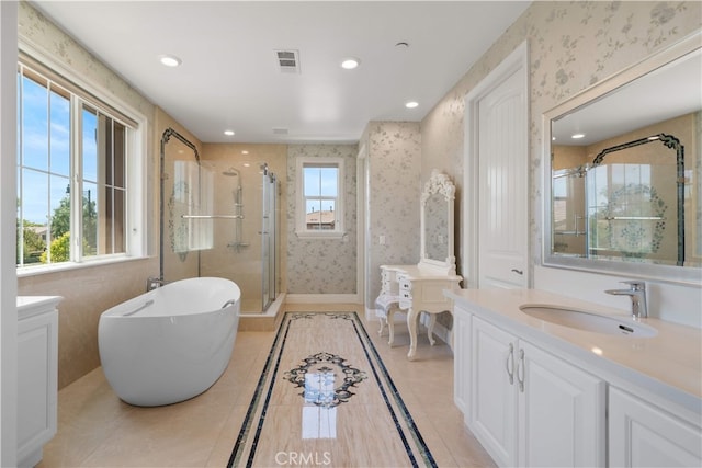 6829 Birmingham Dr, Chino, CA 91710 - bathroom with wallpapered walls, a stall shower, vanity, a freestanding tub, and recessed lighting