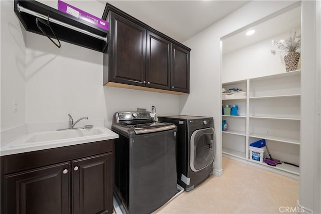 6829 Birmingham Dr, Chino, CA 91710 - laundry area featuring washing machine and clothes dryer, cabinet space, and light tile patterned flooring