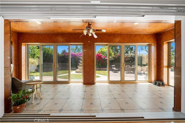 6829 Birmingham Dr, Chino, CA 91710 - doorway with wooden walls and a ceiling fan