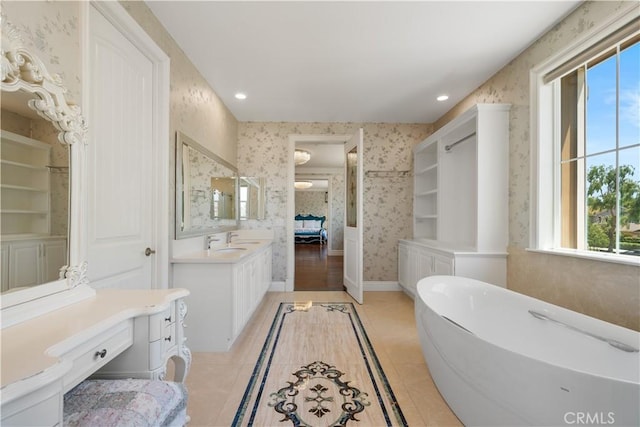 6829 Birmingham Dr, Chino, CA 91710 - bathroom with wallpapered walls, a soaking tub, recessed lighting, baseboards, and tile patterned floors
