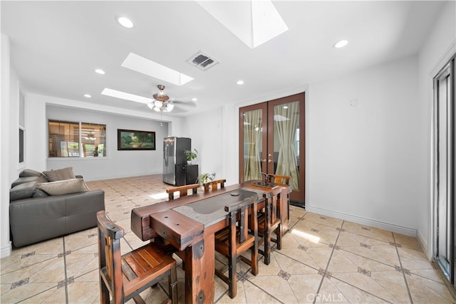 6829 Birmingham Dr, Chino, CA 91710 - dining space featuring a skylight, light tile patterned floors, recessed lighting, french doors, and baseboards