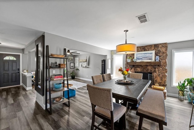 3221 Camarillo Ave, Oceanside, CA 92056 - dining space with wood finished floors, baseboards, a fireplace, and ceiling fan