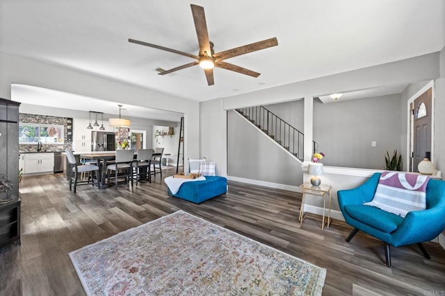 3221 Camarillo Ave, Oceanside, CA 92056 - living area with ceiling fan, wood finished floors, stairs, and baseboards