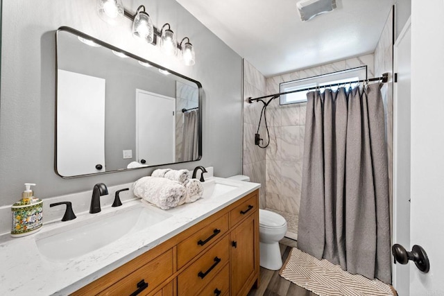 3221 Camarillo Ave, Oceanside, CA 92056 - full bath featuring toilet, a shower with curtain, double vanity, and wood finished floors