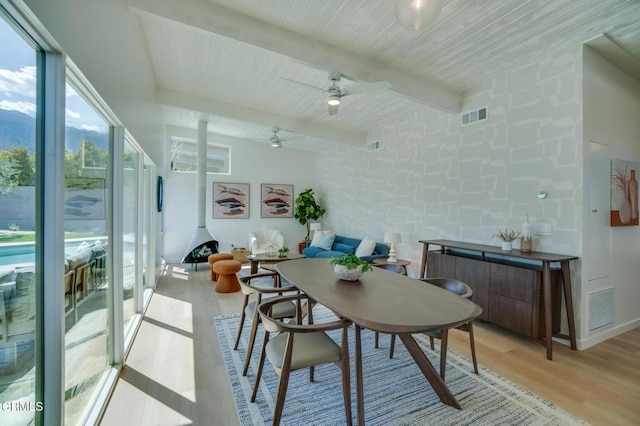 sunroom featuring beamed ceiling