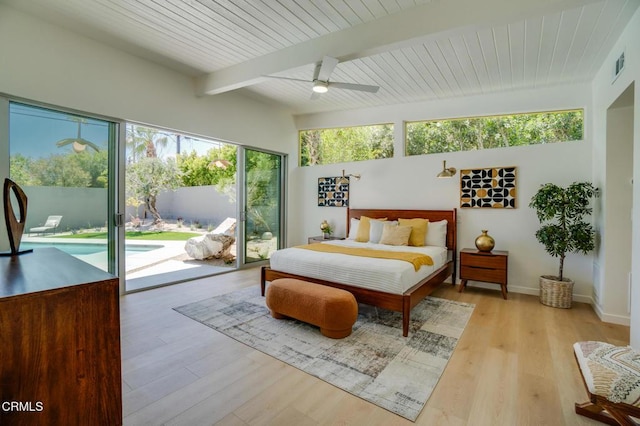 bedroom with access to outside, beam ceiling, light wood-type flooring, a ceiling fan, and baseboards