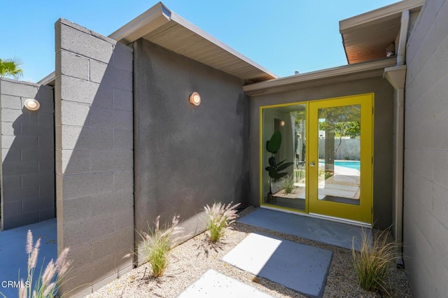 2839 N Davis Way, Palm Springs, CA 92262 - property entrance featuring concrete block siding and french doors