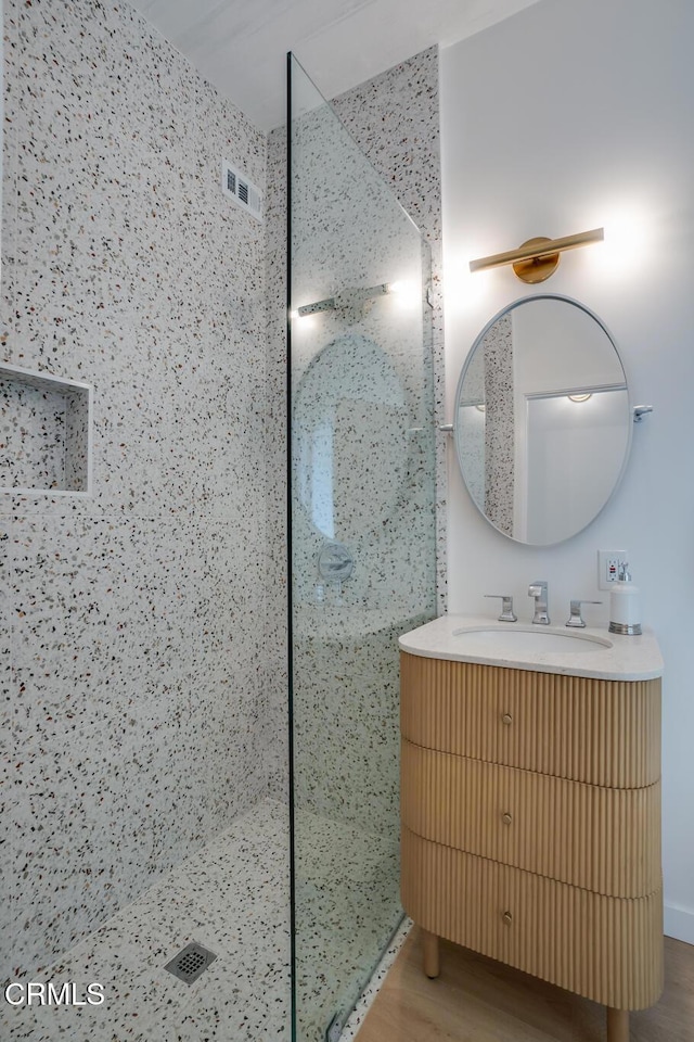 2839 N Davis Way, Palm Springs, CA 92262 - bathroom with walk in shower, vanity, and wood finished floors