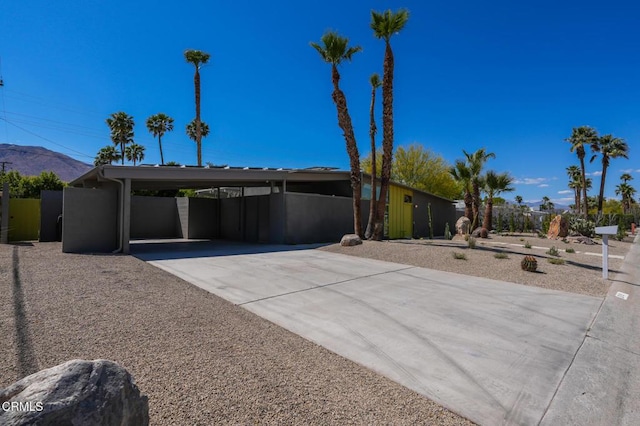 2839 N Davis Way, Palm Springs, CA 92262 - mid-century home featuring driveway, a carport, and a mountain view
