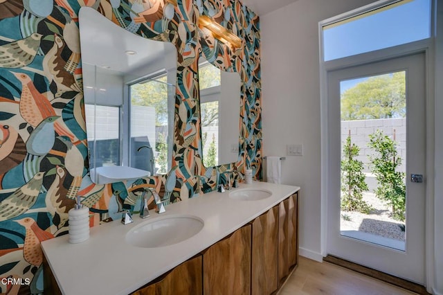 2839 N Davis Way, Palm Springs, CA 92262 - bathroom with double vanity, wood finished floors, and healthy amount of natural light