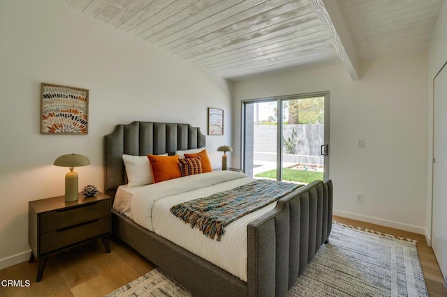 2839 N Davis Way, Palm Springs, CA 92262 - bedroom featuring access to outside, wood finished floors, and a wood ceiling with exposed beams