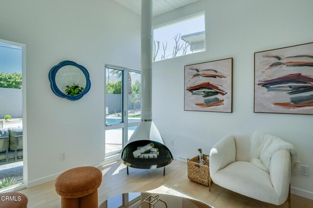 2839 N Davis Way, Palm Springs, CA 92262 - sitting room with plenty of natural light, wood finished floors, and a towering ceiling
