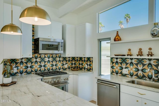 2839 N Davis Way, Palm Springs, CA 92262 - kitchen with appliances with stainless steel finishes, decorative backsplash, white cabinetry, and beam ceiling