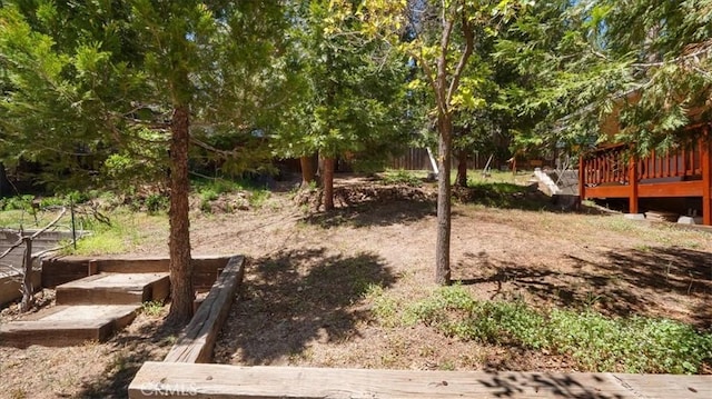 view of yard with a wooden deck