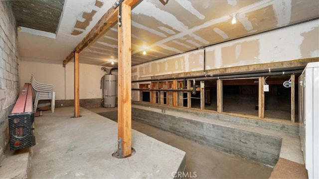 unfinished basement with strapped water heater