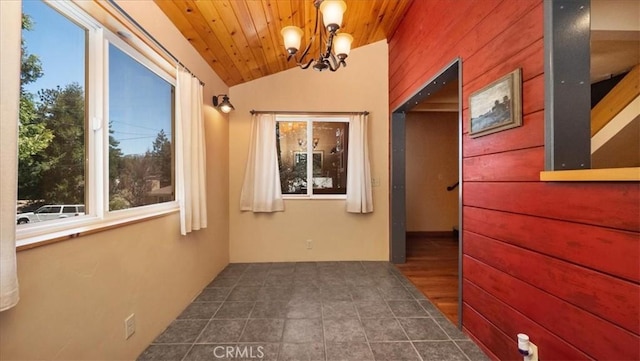 hallway featuring vaulted ceiling, a chandelier, and wooden ceiling