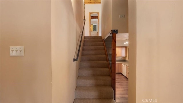 stairs with wood finished floors