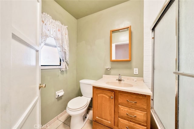 bathroom featuring toilet, tile patterned flooring, vanity, and an enclosed shower