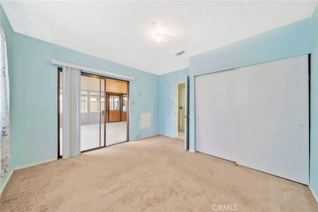 unfurnished bedroom featuring carpet flooring and baseboards