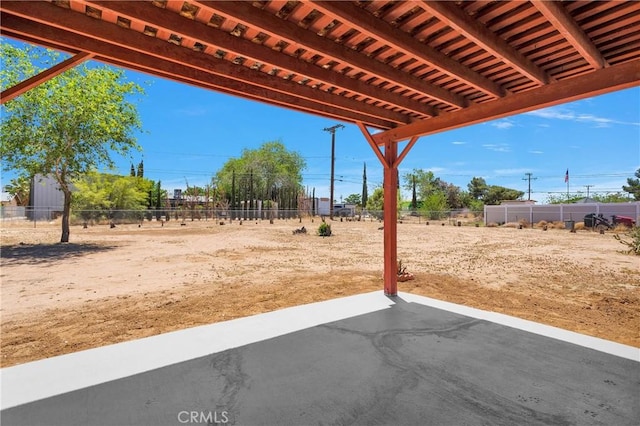 view of patio / terrace featuring fence
