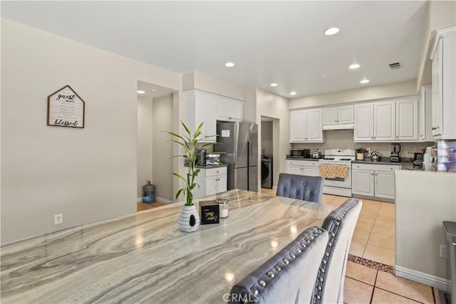 3818 Coastal St, Riverside, CA 92501 - dining area with washer / clothes dryer, light tile patterned flooring, and recessed lighting