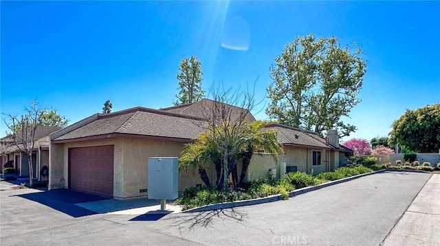 501 Berry Way, La Habra, CA 90631 - view of side of home featuring stucco siding and a garage