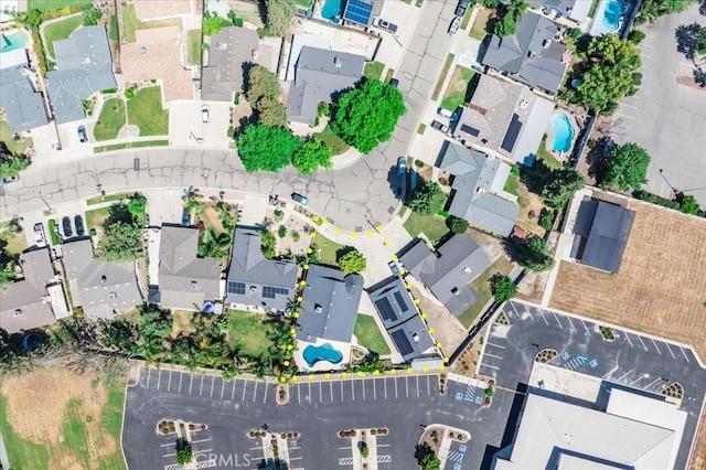 1995 E Valley Forge Ave, Tulare, CA 93274 - aerial overview of property's location featuring nearby suburban area and a pool area