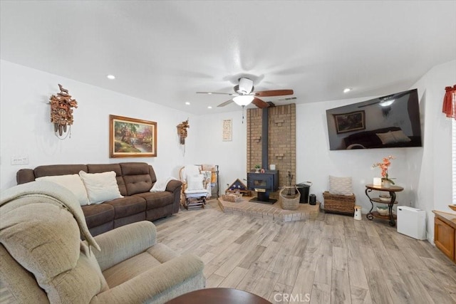 1995 E Valley Forge Ave, Tulare, CA 93274 - living area with a wood stove, light wood-type flooring, recessed lighting, and a ceiling fan