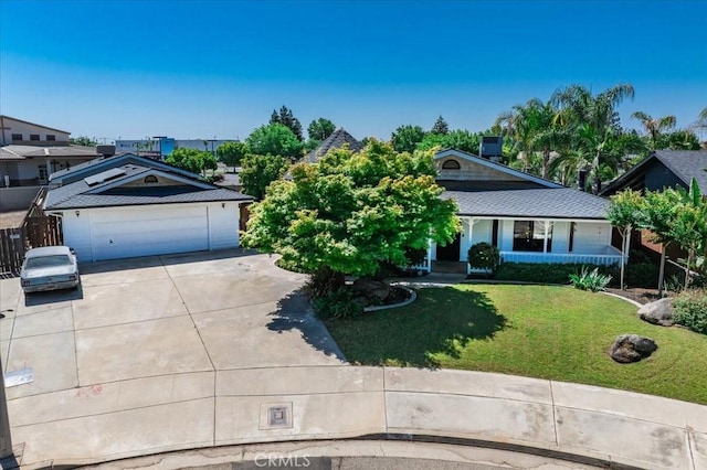 1995 E Valley Forge Ave, Tulare, CA 93274 - view of front of property with concrete driveway, a garage, and a front yard
