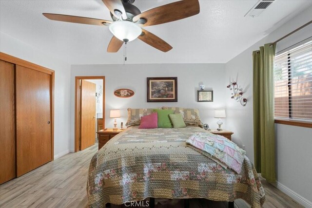 1995 E Valley Forge Ave, Tulare, CA 93274 - bedroom featuring light wood-style floors, baseboards, a closet, and ceiling fan