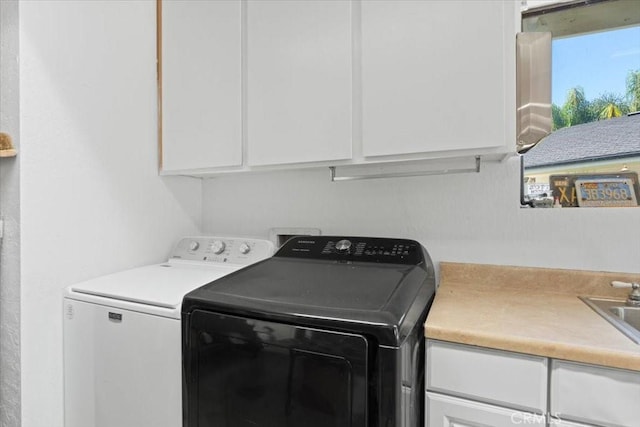 1995 E Valley Forge Ave, Tulare, CA 93274 - clothes washing area featuring cabinet space and independent washer and dryer
