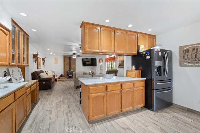 1995 E Valley Forge Ave, Tulare, CA 93274 - kitchen featuring stainless steel refrigerator with ice dispenser, ceiling fan, light wood-style flooring, light countertops, and recessed lighting