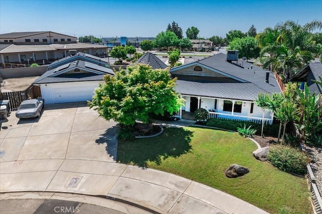 1995 E Valley Forge Ave, Tulare, CA 93274 - view of front facade featuring concrete driveway, a garage, and a front yard