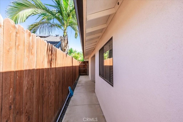 1995 E Valley Forge Ave, Tulare, CA 93274 - view of side of home featuring stucco siding and fence