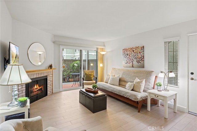 living room featuring a fireplace and wood finished floors