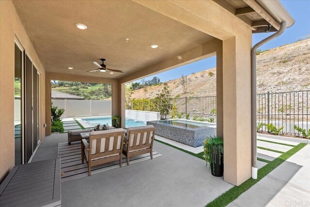 940 Lindbergh Dr, San Marcos, CA 92069 - fenced backyard with a patio area, a ceiling fan, a mountain view, and a pool with connected hot tub