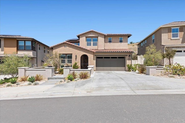940 Lindbergh Dr, San Marcos, CA 92069 - mediterranean / spanish house with a tiled roof, an attached garage, stucco siding, and concrete driveway