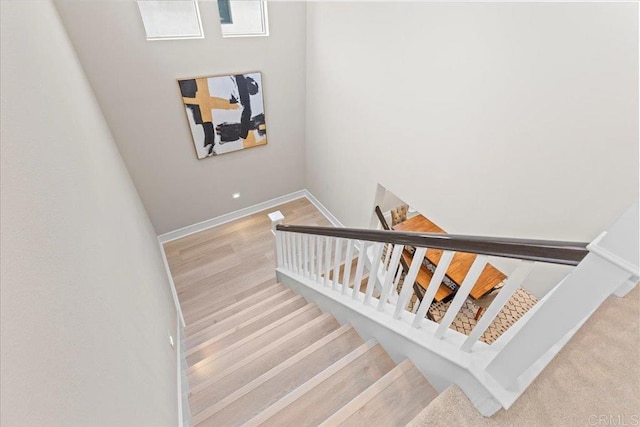 940 Lindbergh Dr, San Marcos, CA 92069 - stairs with baseboards and wood finished floors